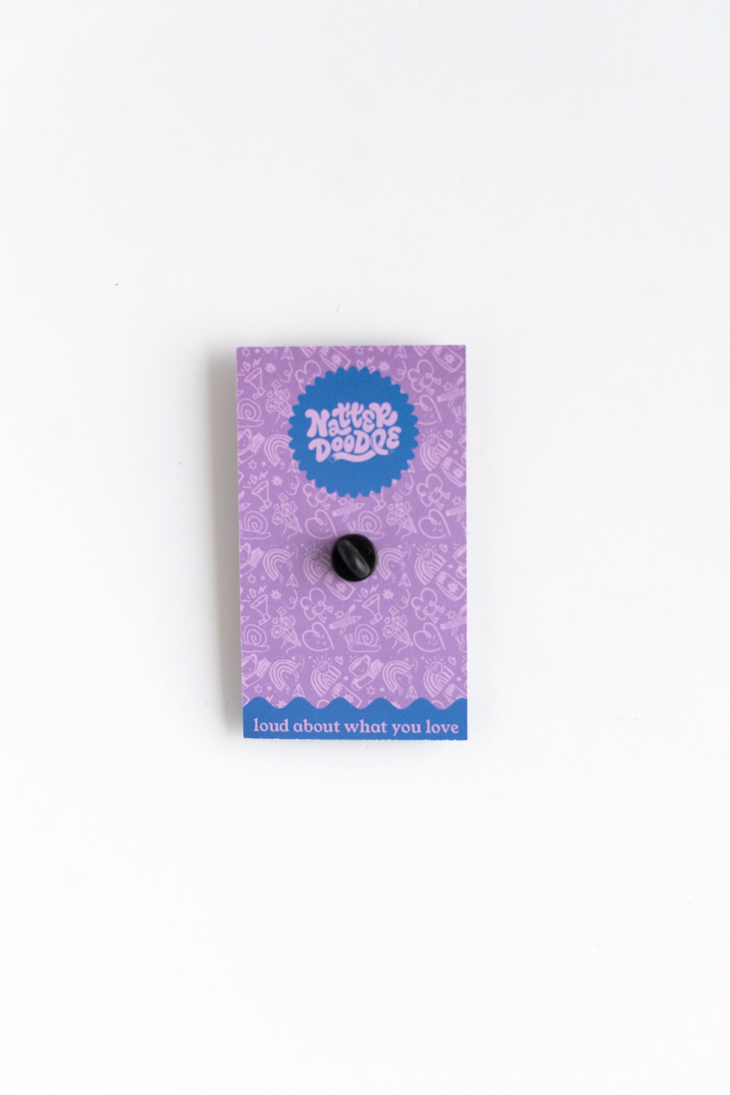 Purple card with a black button on a white background