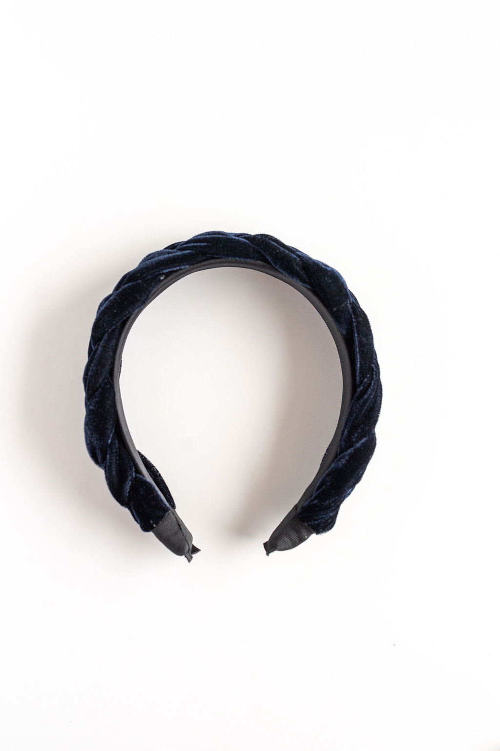 Navy blue velvet headband on a white background