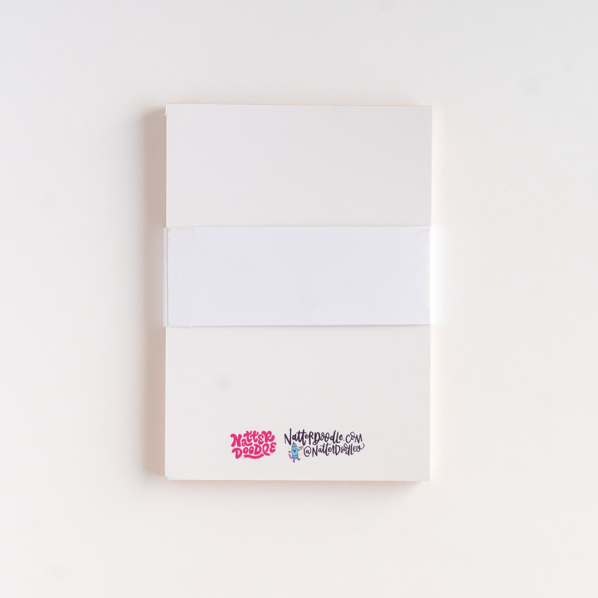 White notebook with colorful text on a white background