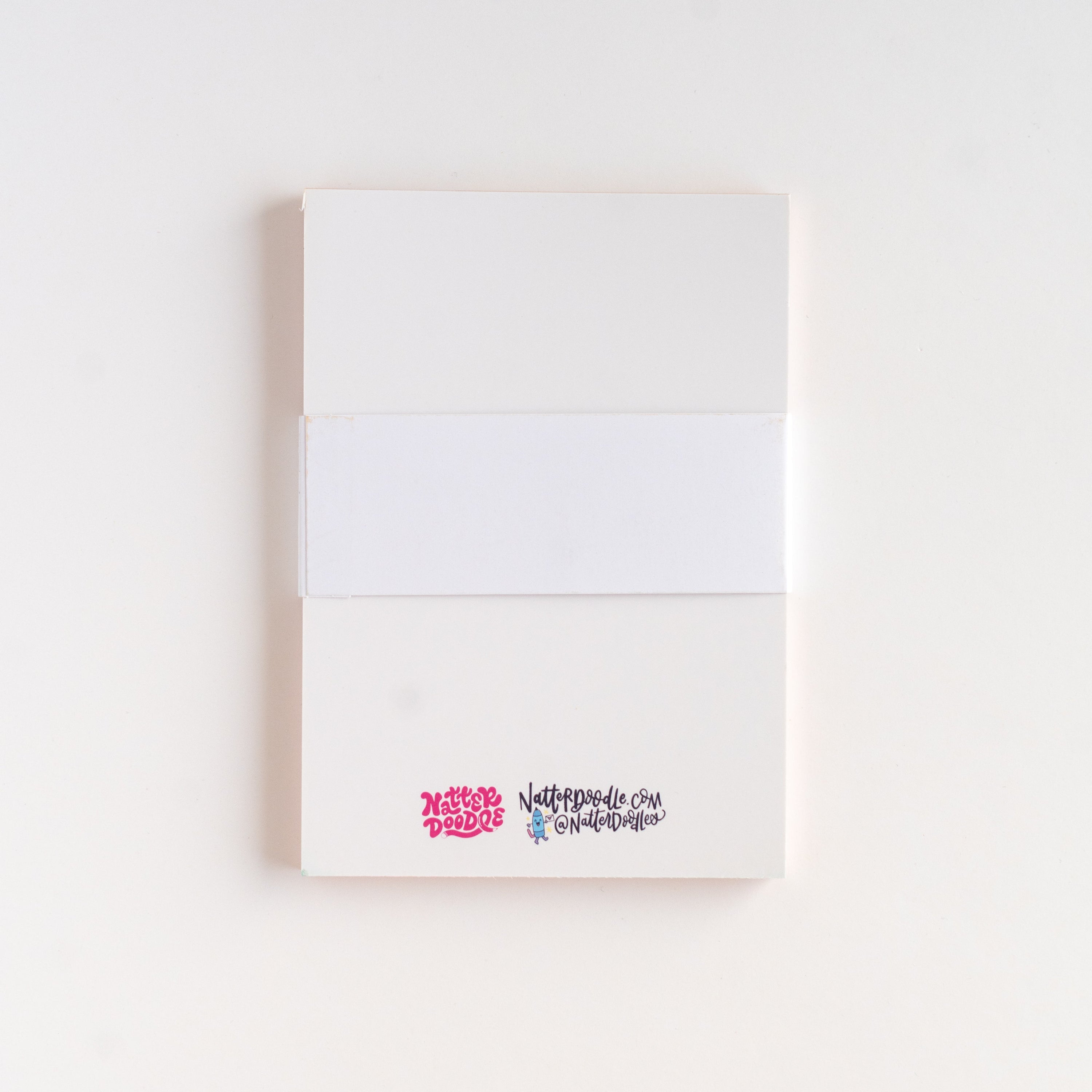 White notebook with colorful text on a white background
