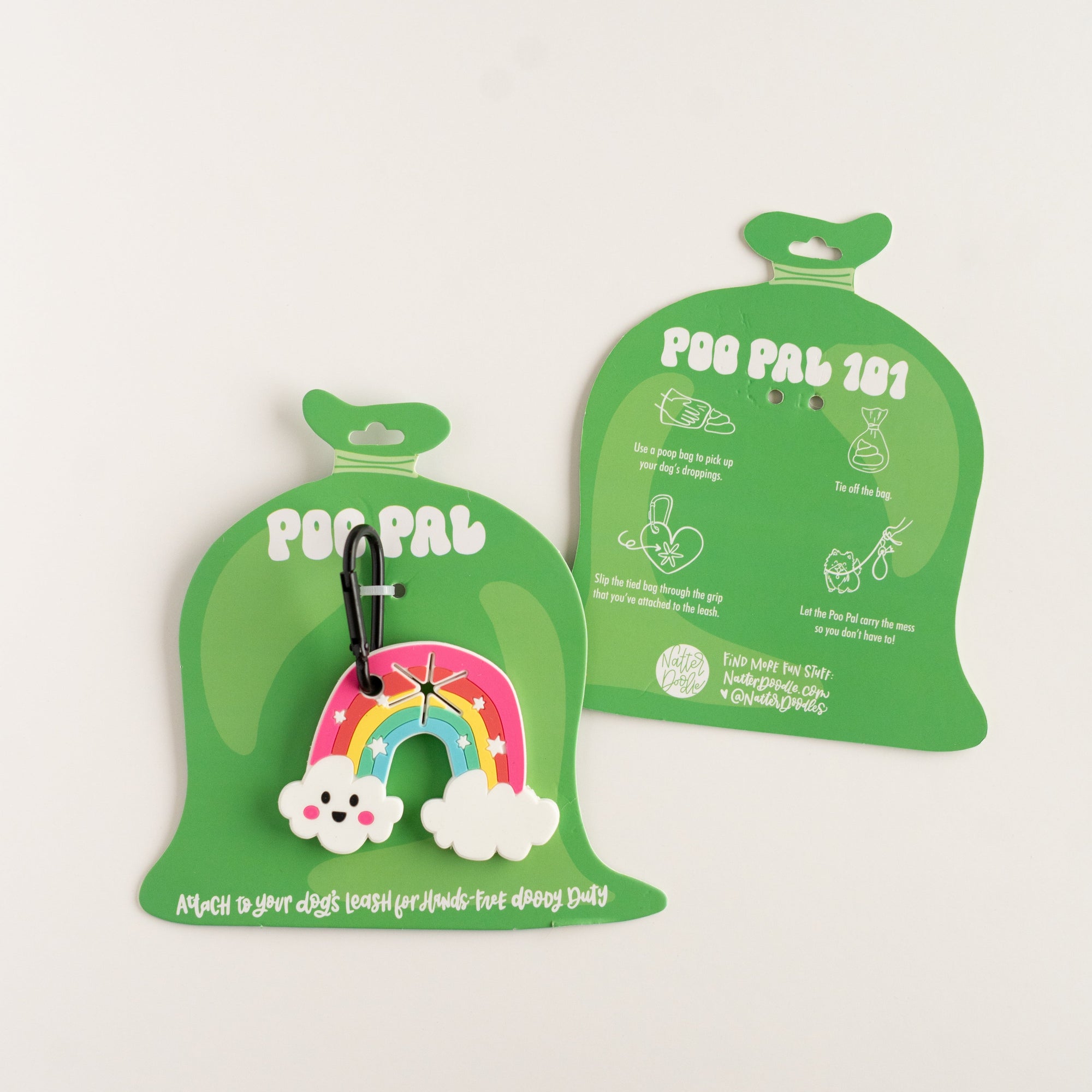 Two green 'POO PAL' bags with a rainbow-shaped poop bag holder on a light beige background.