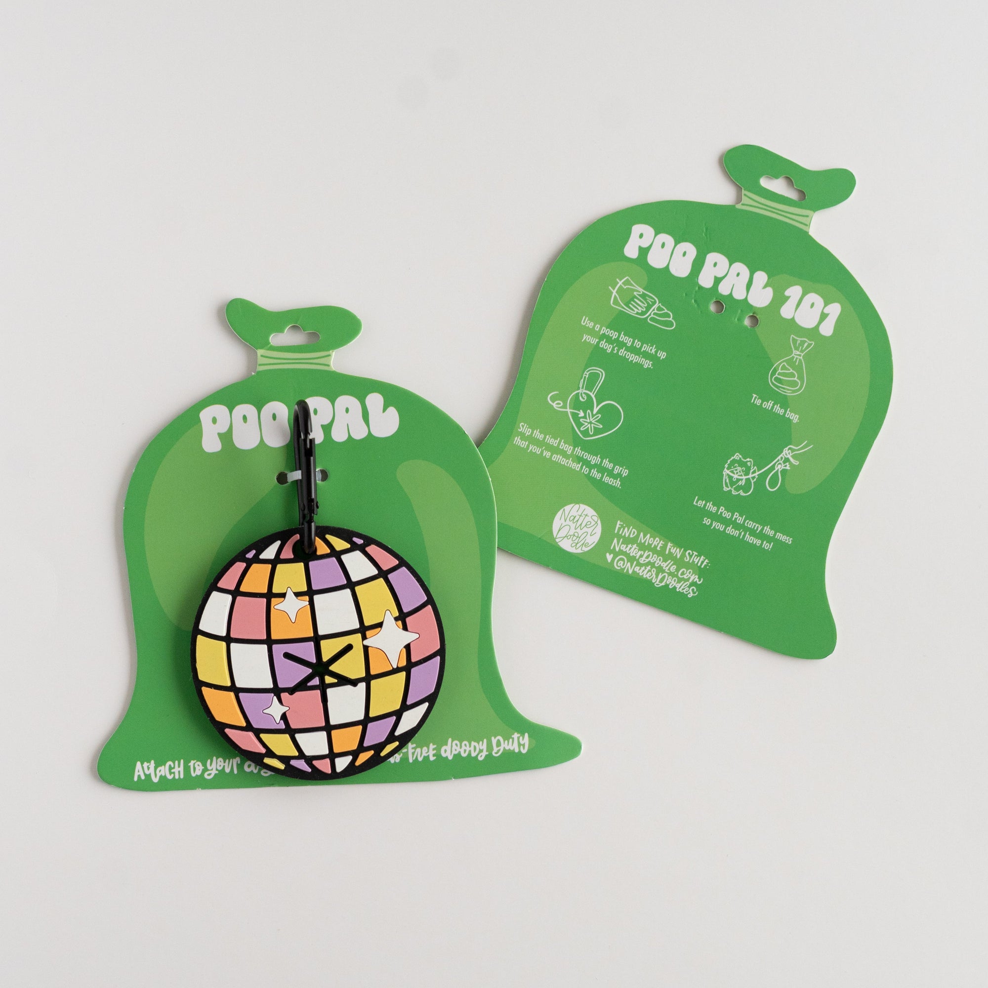 Two green pet waste shaped packaging with dog accessories with a colorful disco ball on a white background