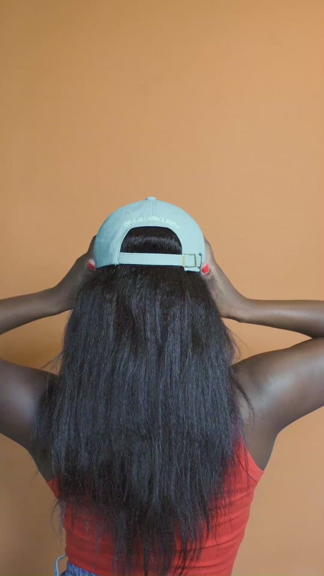 Gold-tone metal adjustable clasp on the back of the Eldest Daughter dad cap