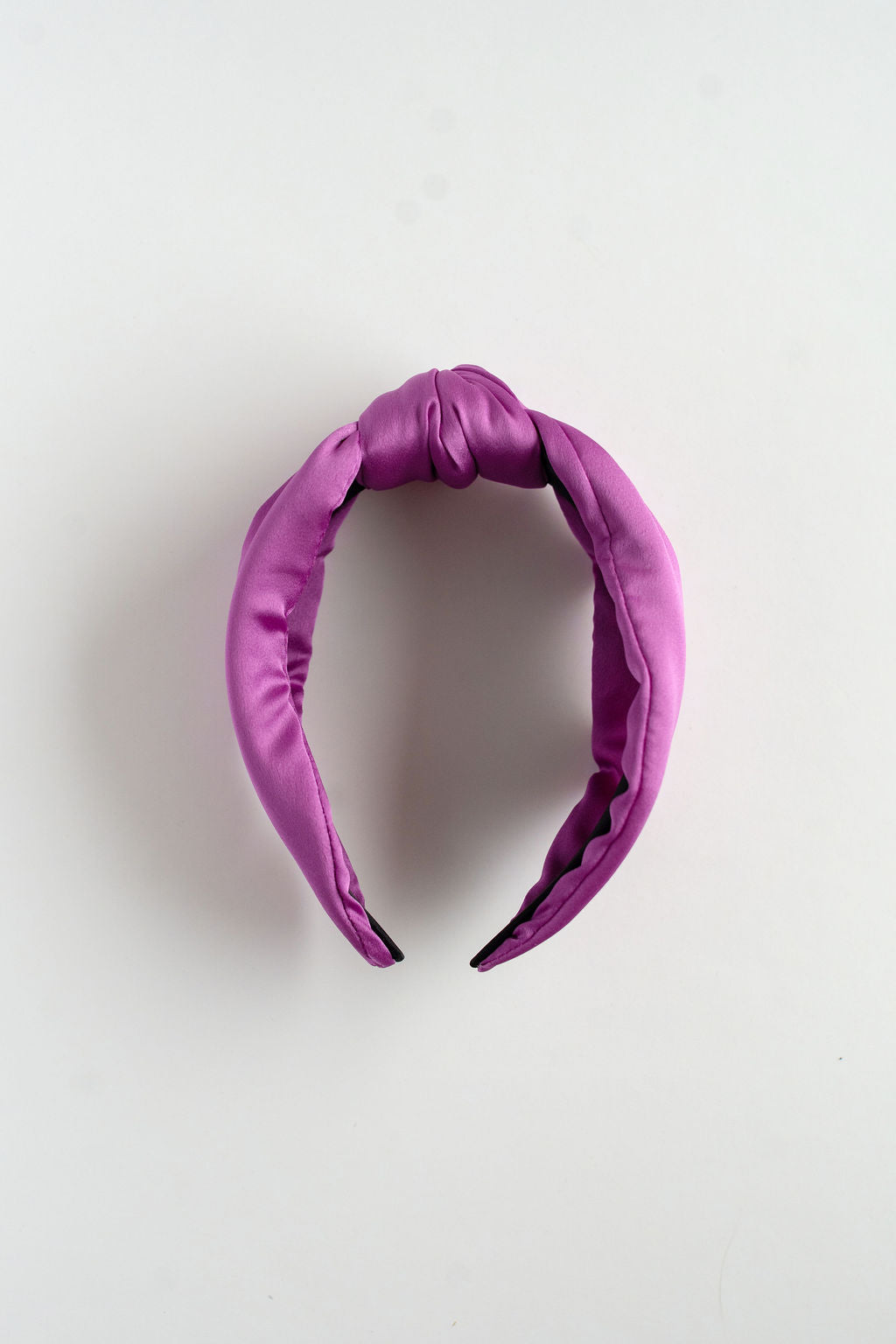 Purple headband on a light gray background