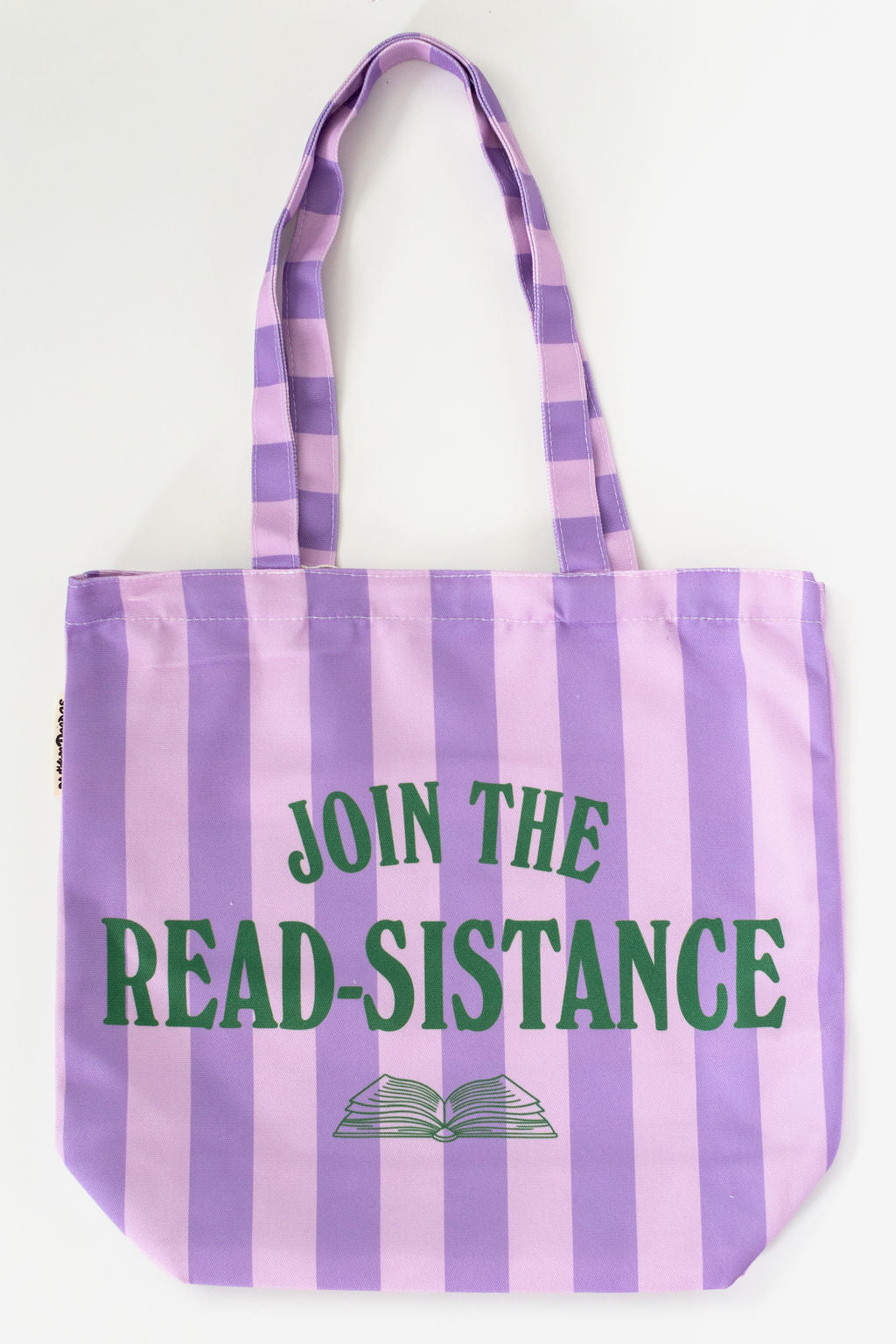 Striped tote bag with 'Join the Read-Sistance' text on a white background