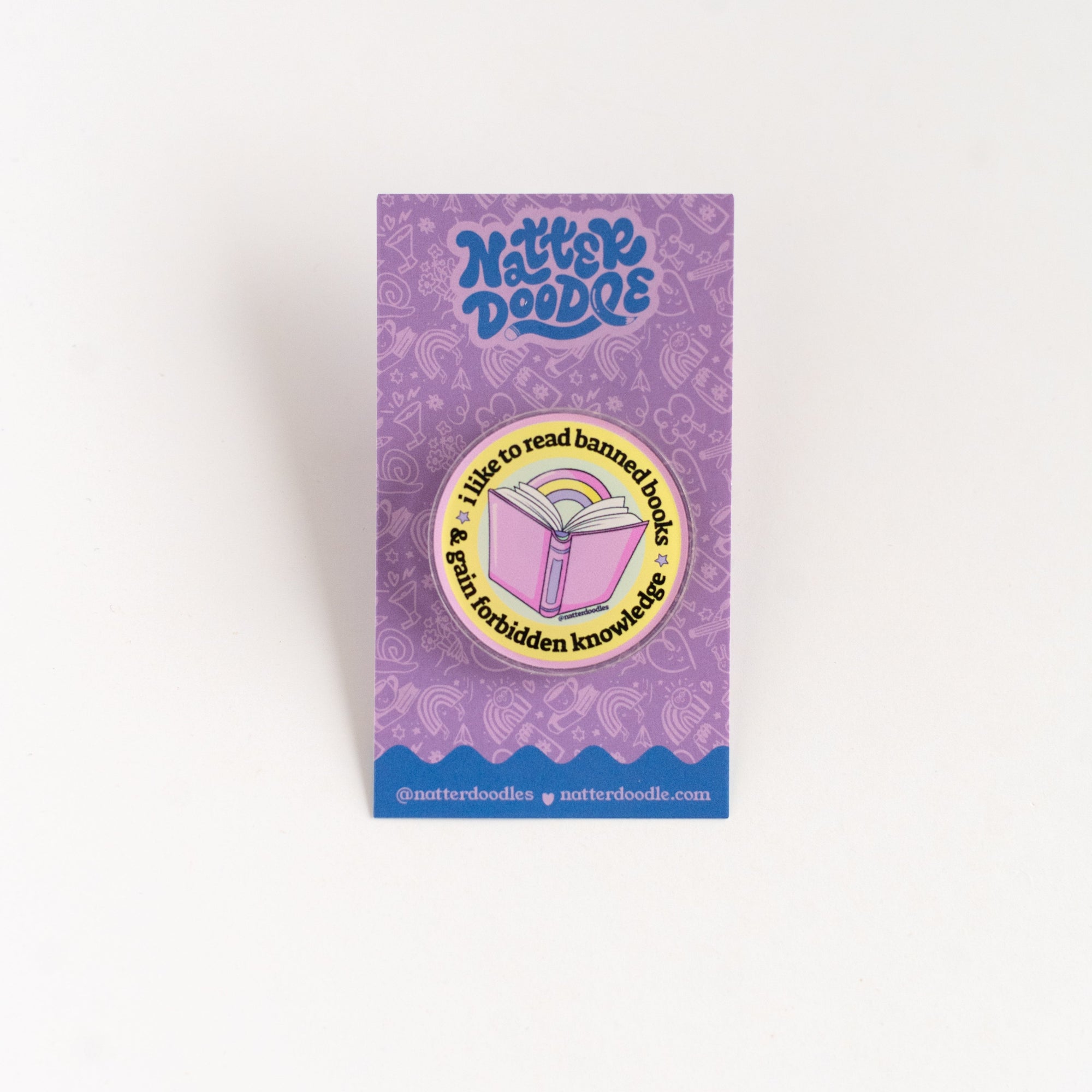 Purple packaging with read banned books lapel pin acrylic
