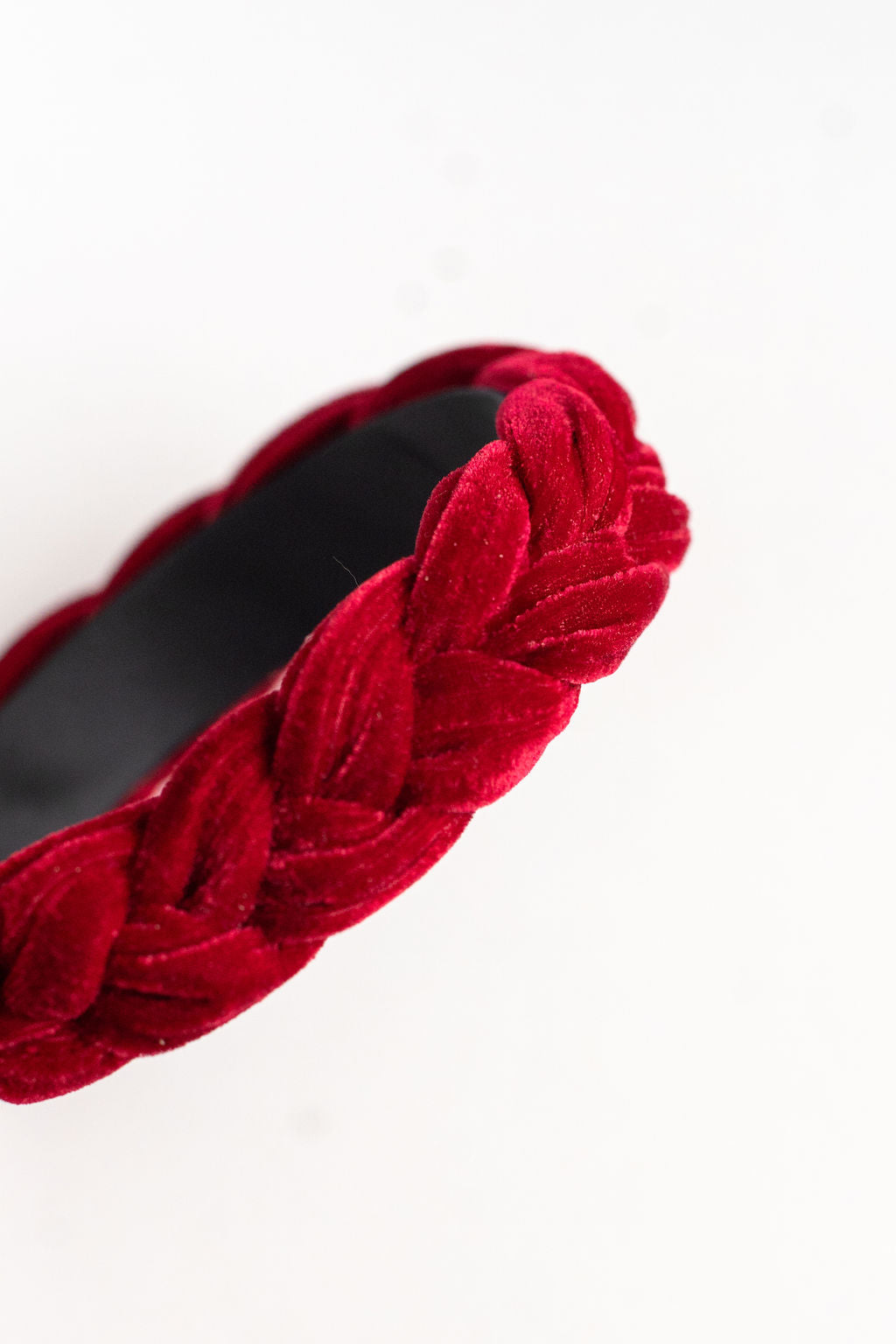 Red velvet headband on a white background