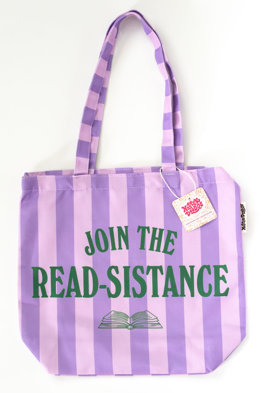Striped tote bag with 'Join the Read-Sistance' text and a book icon on a white background