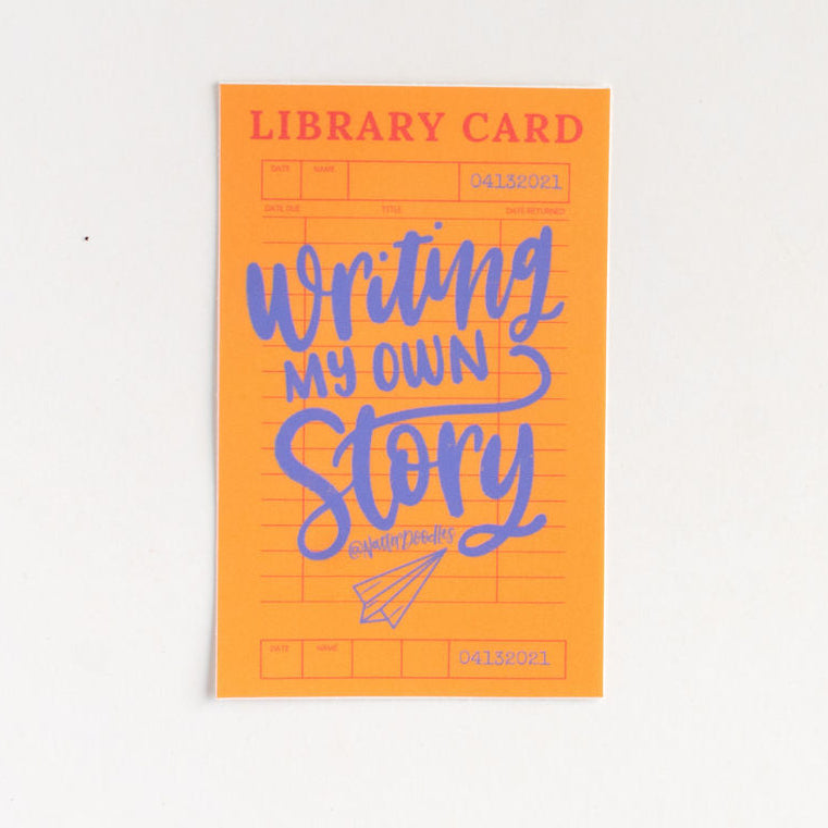 Orange sticker  titled 'Writing My Own Story' on a white background